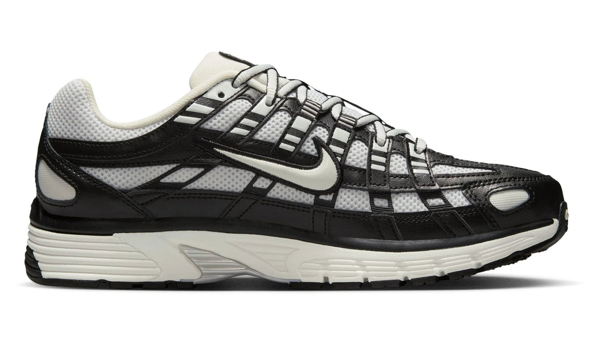 Black and white running shoe on a white background