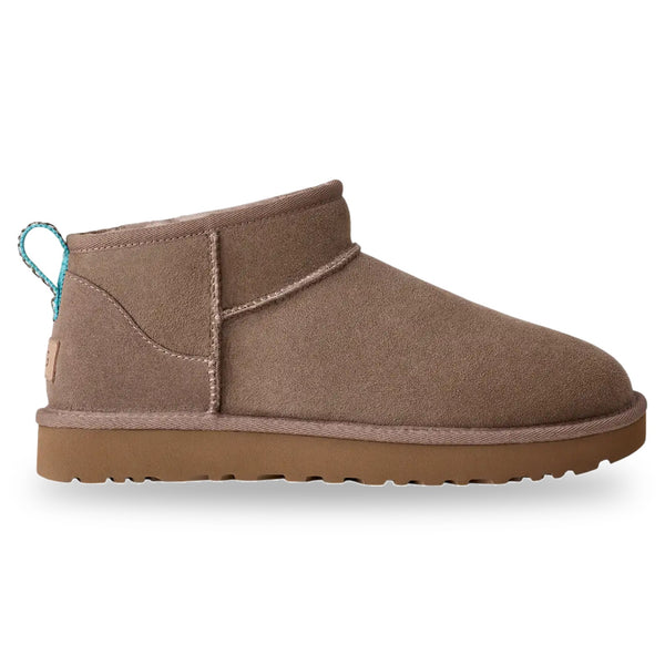 Brown suede ankle boot with a white background