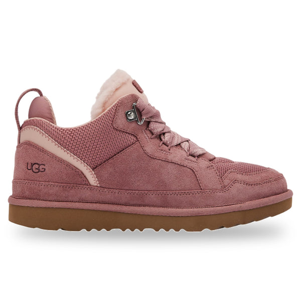 Pink UGG sneaker with brown sole on a white background