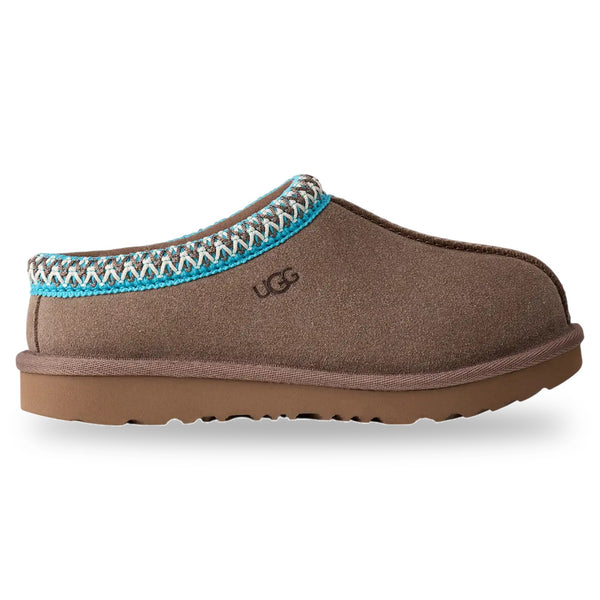 Brown UGG slippers with a decorative strap on a white background