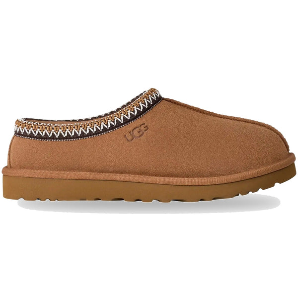 Brown slipper with decorative trim on a white background