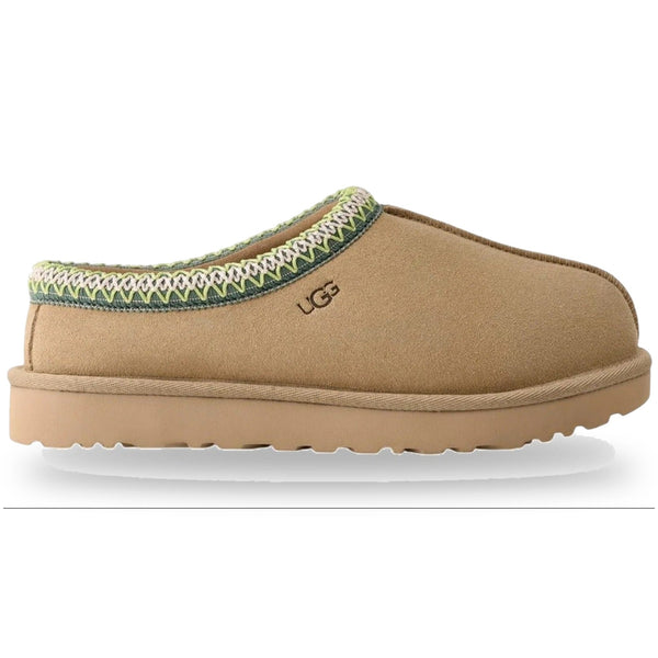 Tan slipper with green trim on a white background
