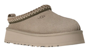 Beige UGG slipper on a white background