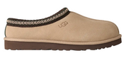 Beige UGG slipper with brown trim on a white background