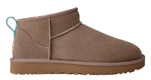 Brown suede ankle boot with a white background