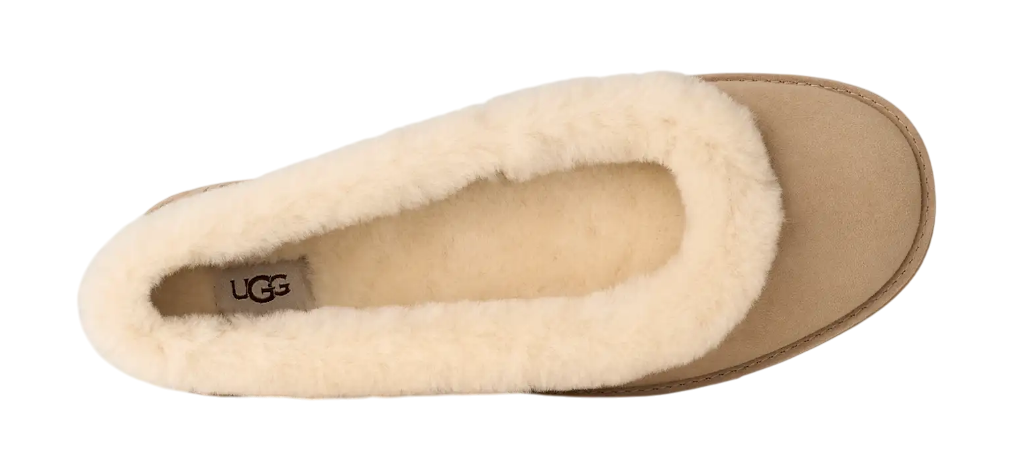 Beige UGG slipper on a white background