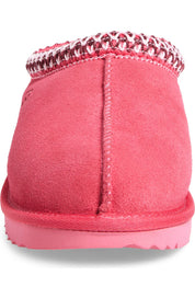 Pink slip-on shoe with a textured sole on a white background