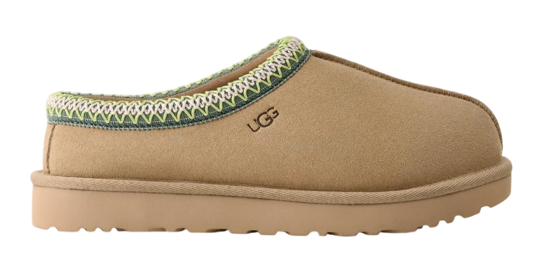 Tan slipper with green trim on a white background