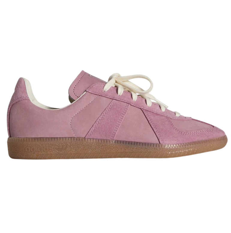 Pink sneaker with a brown sole on a white background