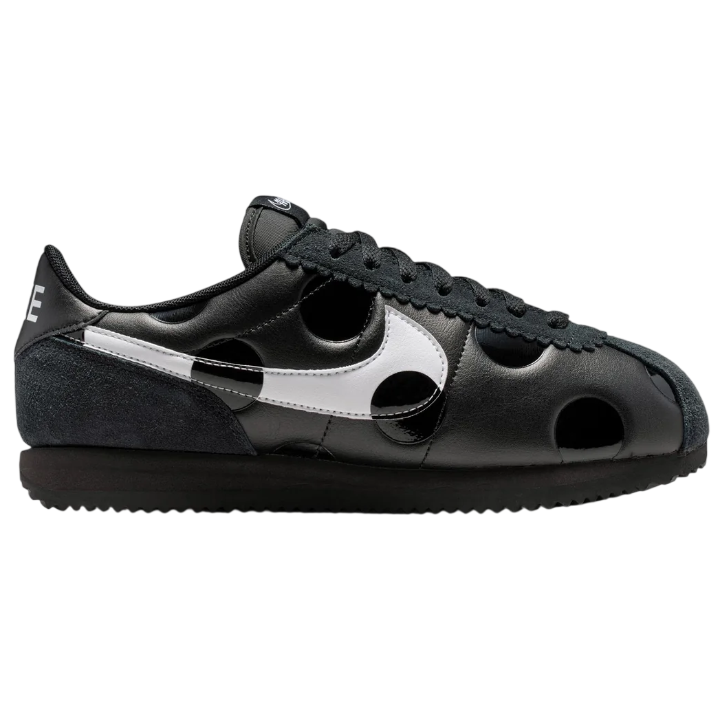 Black sneaker with white accents on a white background