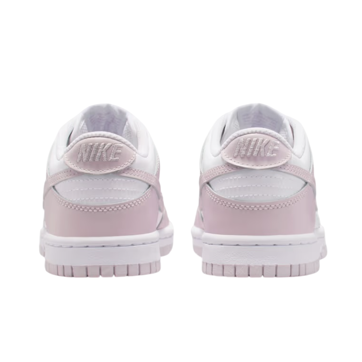 Pair of pink sneakers on a white background