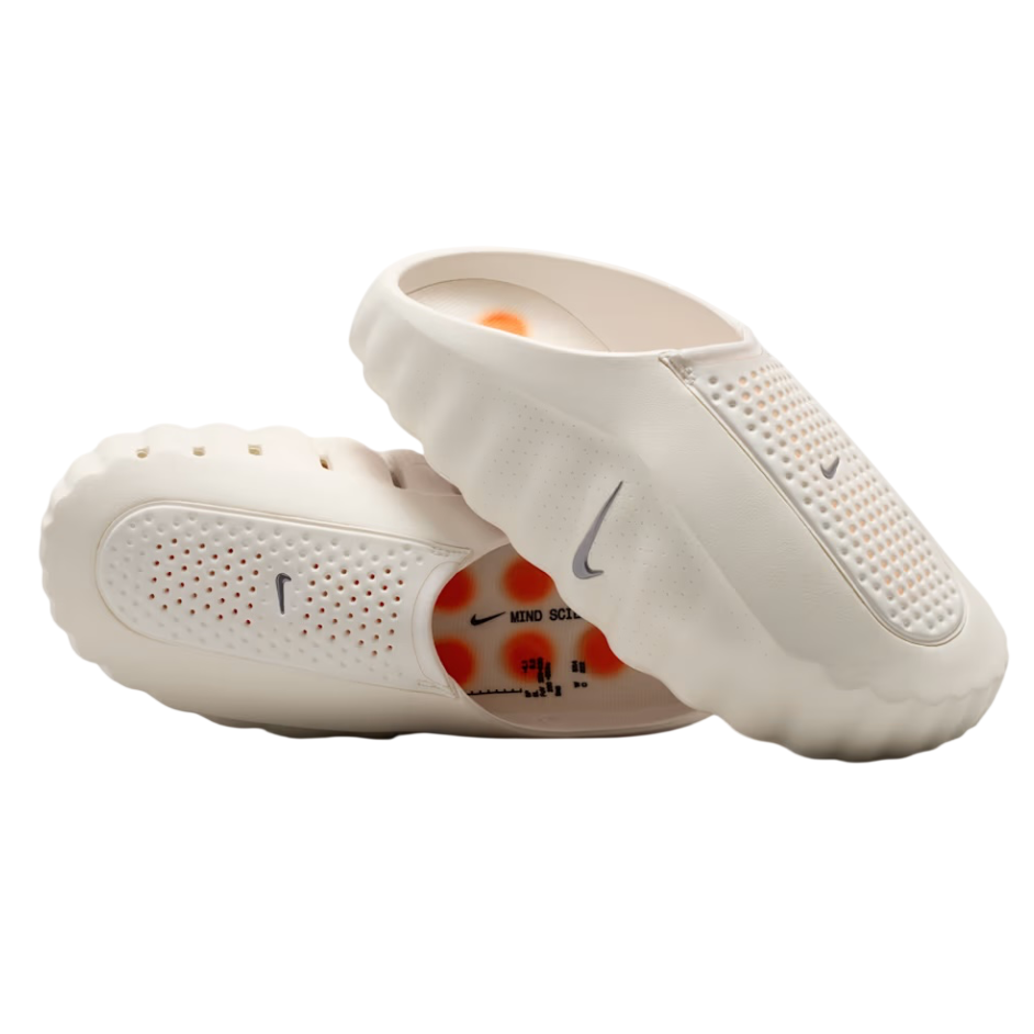 White baby shoes with Nike logo on a white background