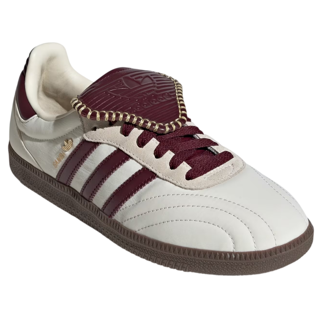 White and maroon sneaker with Adidas logo on a white background