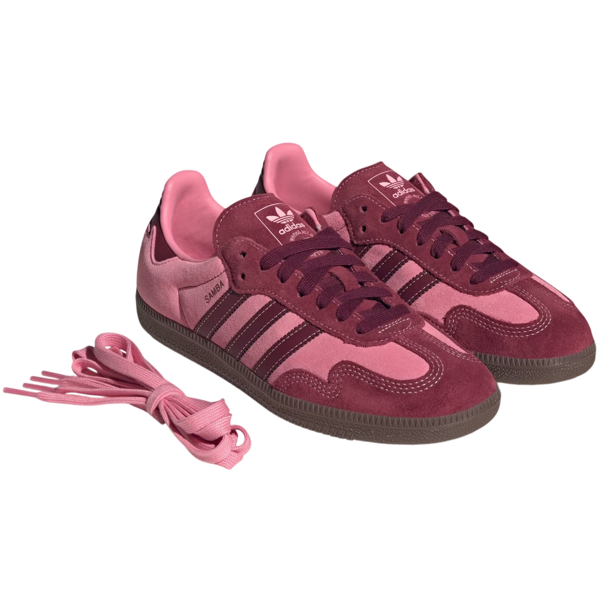 Pink and maroon Adidas sneakers with matching laces on a white background