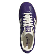 Purple Adidas sneaker with white laces on a white background