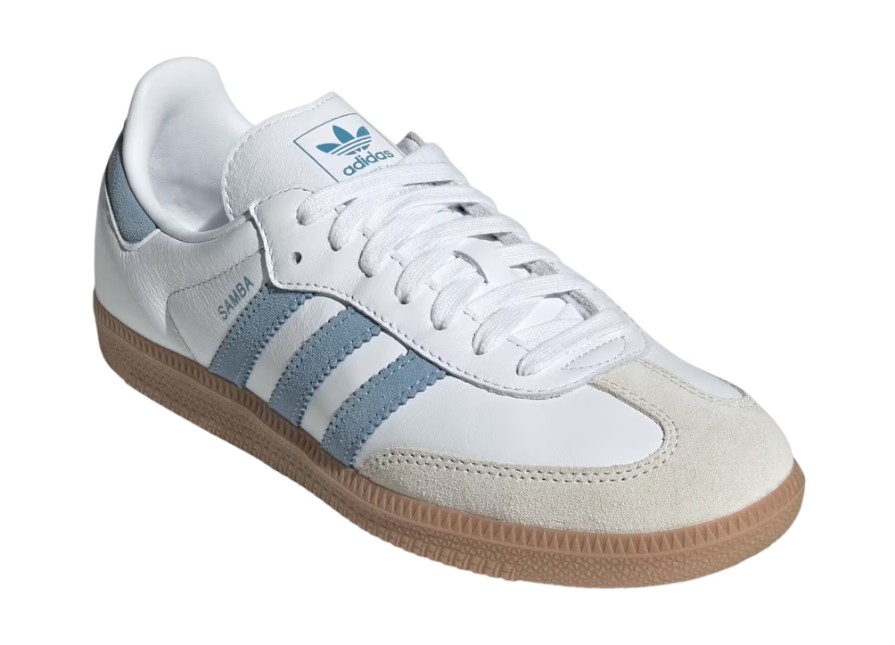 White Adidas sneaker with blue stripes on a white background