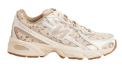 Beige sneaker with floral pattern on a white background