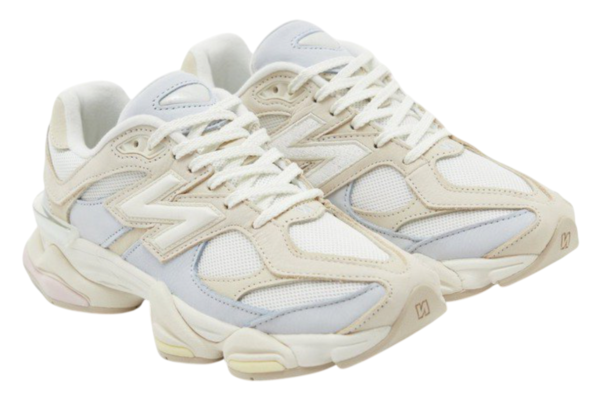 Pair of beige and white sneakers on a white background