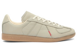 Beige Adidas sneaker with a red accent on a white background - Image 1