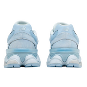 Light blue sneakers with white soles on a white background