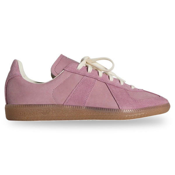 Pink sneaker with a brown sole on a white background