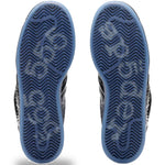 Close-up of the soles of a pair of shoes with a white background - Image 5