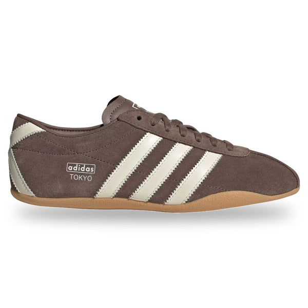 Brown Adidas sneaker with white stripes on a white background