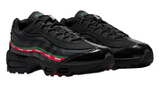 Black sneakers with a red and green stripe on a white background
