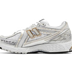 White running shoe with gold accents on a white background - Image 2