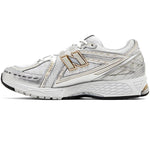 White running shoe with gold accents on a white background - Image 2