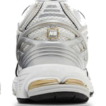 White and gold athletic shoes on a white background - Image 4