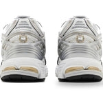White and gold athletic shoes on a white background - Image 4