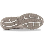 Close-up of a gray shoe sole with New Balance branding on a white background - Image 5