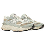 Pair of light gray sneakers with beige accents on a white background - Image 2