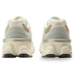 Pair of light gray sneakers with New Balance logo on a white background - Image 5