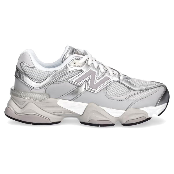 White sneakers with brand logo on a white background