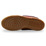 Close-up of a brown sneaker sole with brand logo on a white background - Image 4