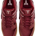 Pair of maroon sneakers with white accents on a white background - Image 5