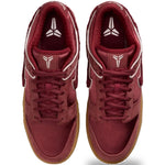 Pair of maroon sneakers with white accents on a white background - Image 5