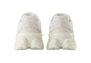White sneakers with a transparent sole on a light gray background