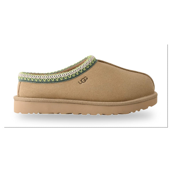 Tan slipper with green trim on a white background