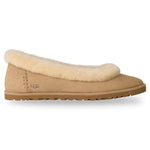 Beige UGG slipper with fluffy trim on a white background - Image 1